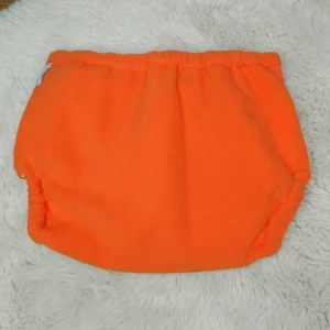 Surcouche ORANGE en micro polaire XS (2 à 6 kg) – BEBELA